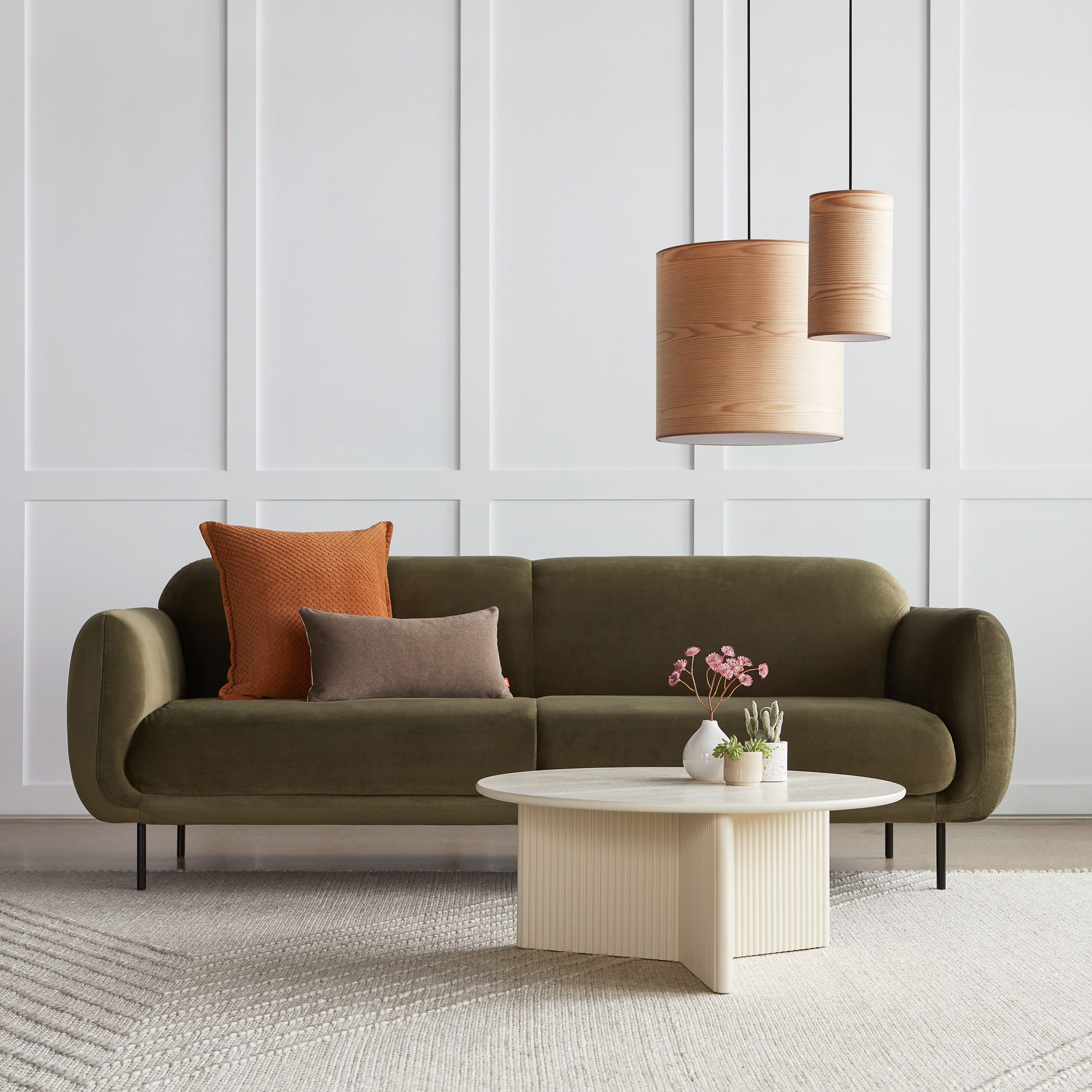 The Nord Sofa in green Casella Grove Fabric with the Odeon Coffee Table in Pearl