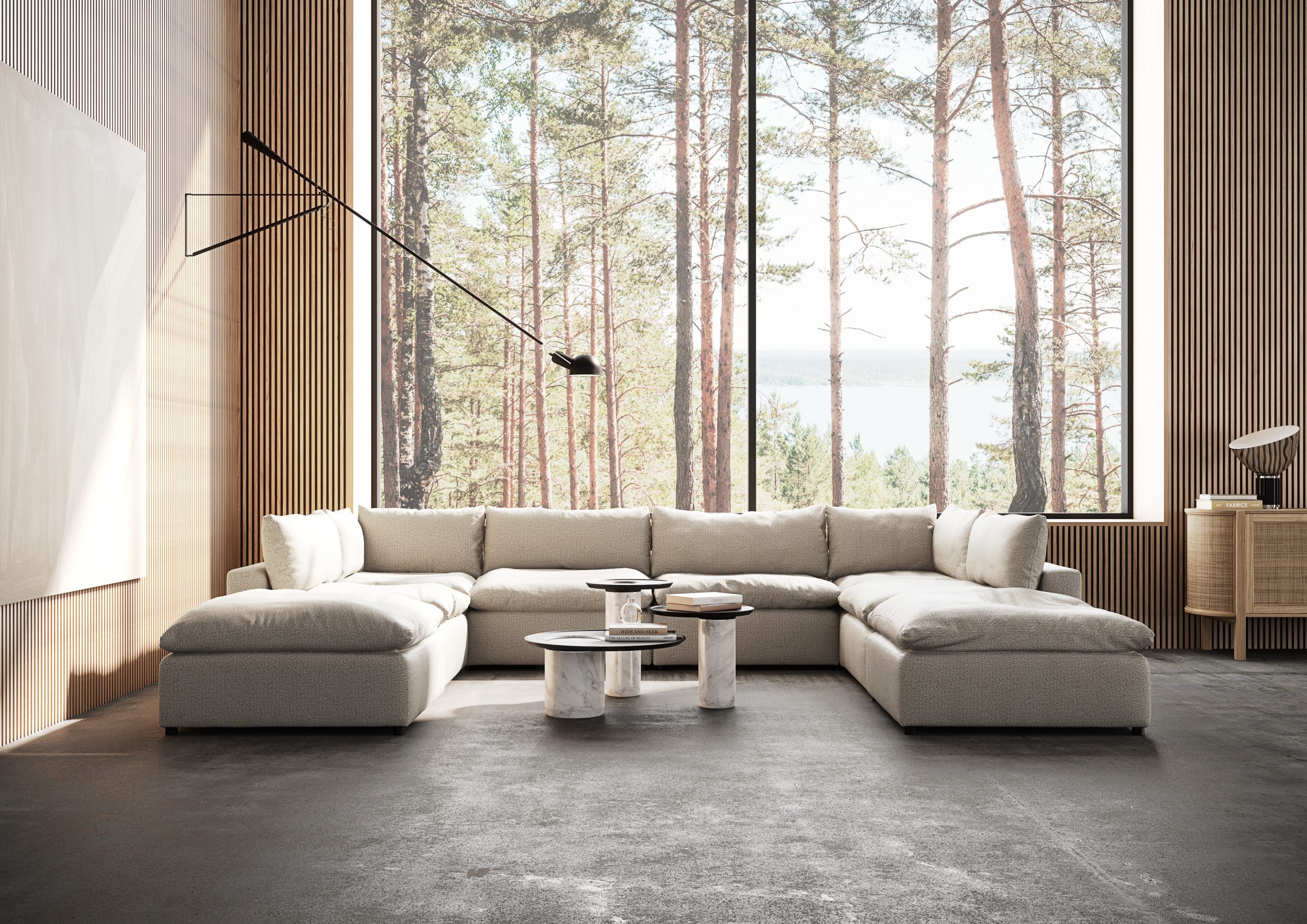 The Moonlight Sectional in a living room with a forested view